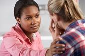Woman comforting patient Woman comforting patient
