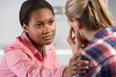 Woman comforting patient