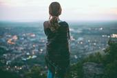 woman looking at evening cityscape woman looking at evening cityscape