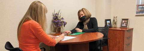 Mindy Rickard helps client with advance care plan