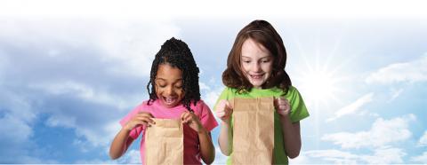 elementary school age girls with lunch bags