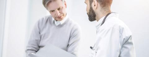 man consulting with doctor