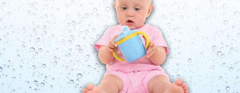 baby looking at sippy cup