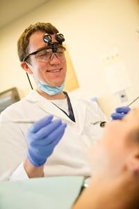 Dentist getting ready to work on patient